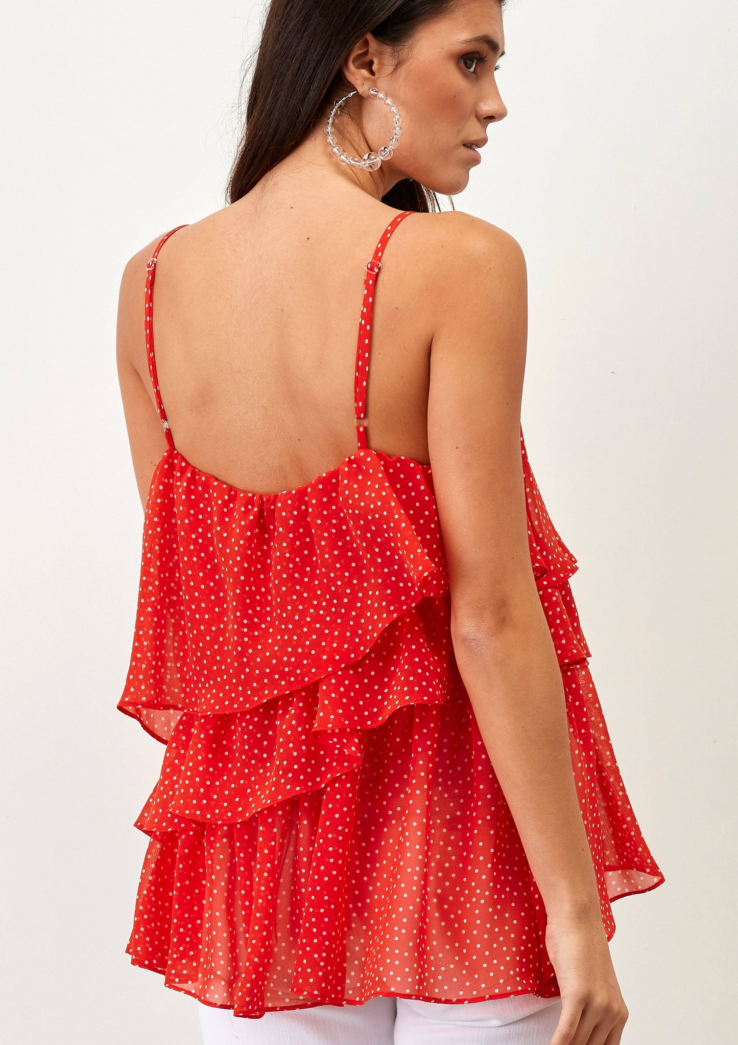 Top a pois con balze e spalline sottili