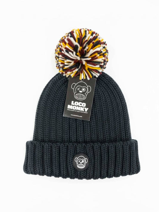 Berretto a costine con pompon e interno in eco-pelliccia