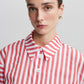 Camicia a righe rosse con bottoni a vista