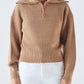 Maglia a costine con zip e collo ampio