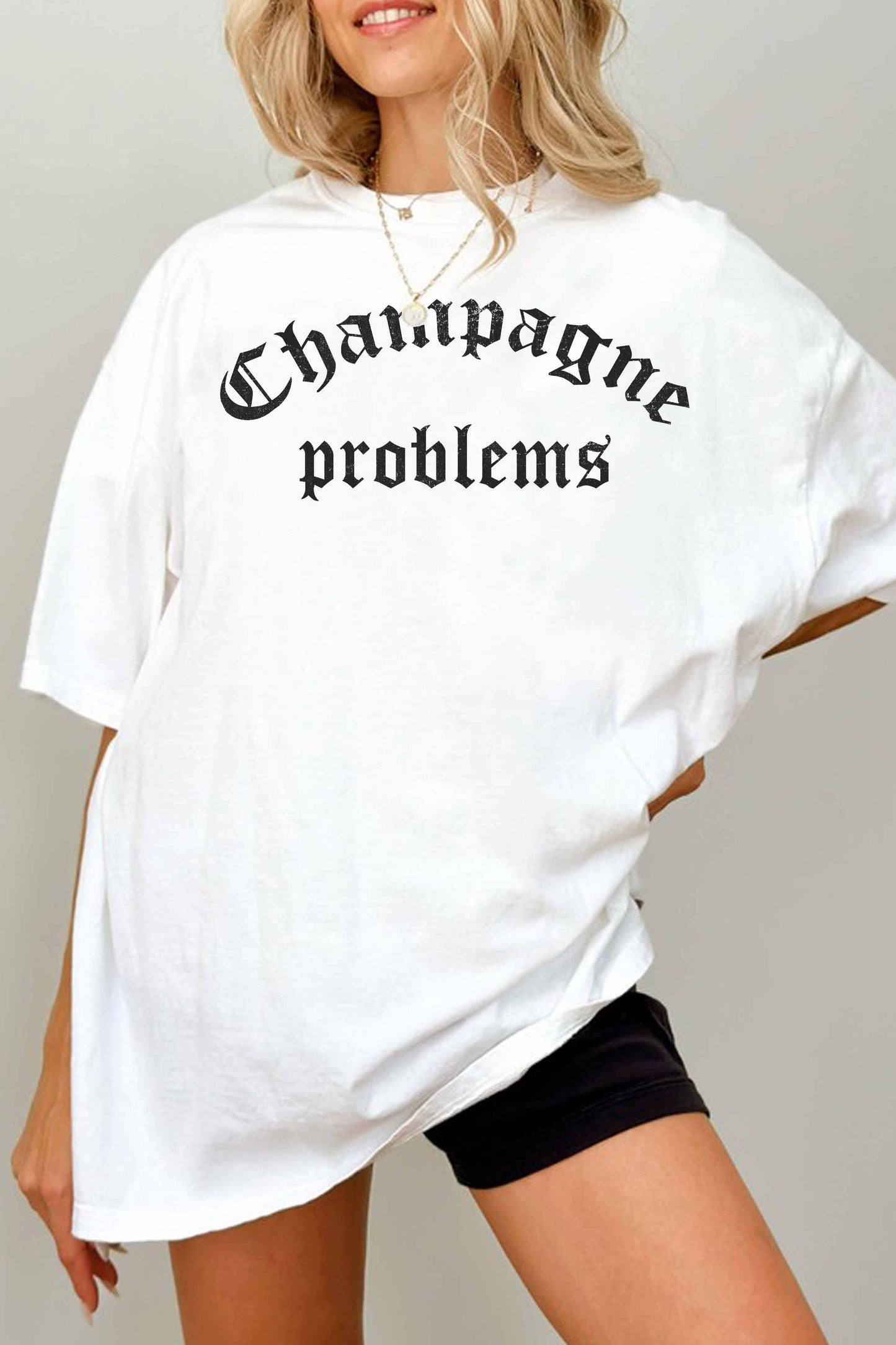 T-shirt oversize grafica “Champagne Problems”