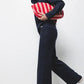 Pantaloni larghi in maglia con dettagli crochet