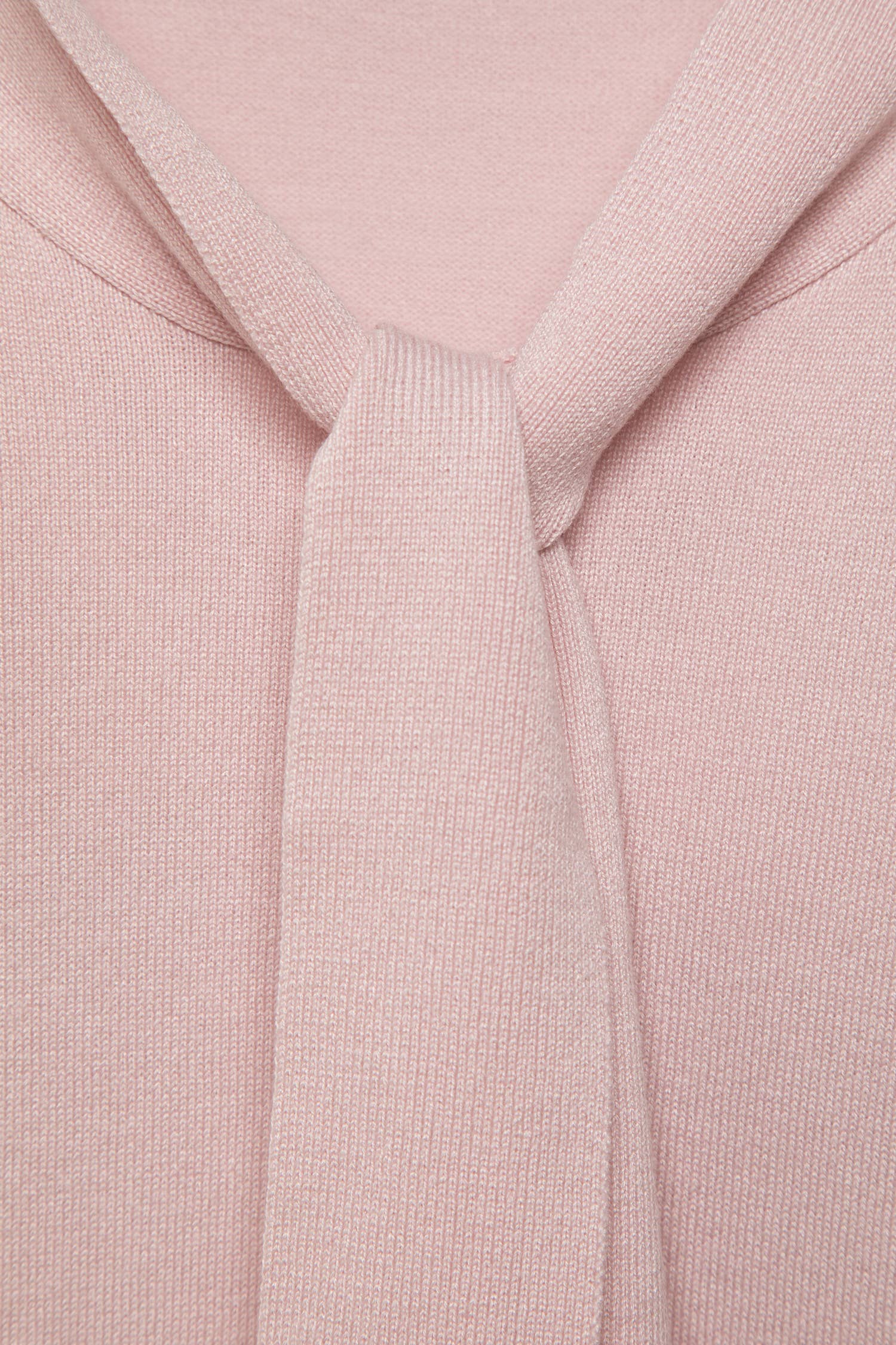Maglione in maglia rasata con fiocco e scollo a V