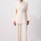 Completo donna camicia testurizzata con cintura e pantaloni palazzo