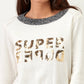 Maglia in cotone con paillettes e scritta