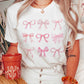 T-shirt grafica con fiocchi rosa