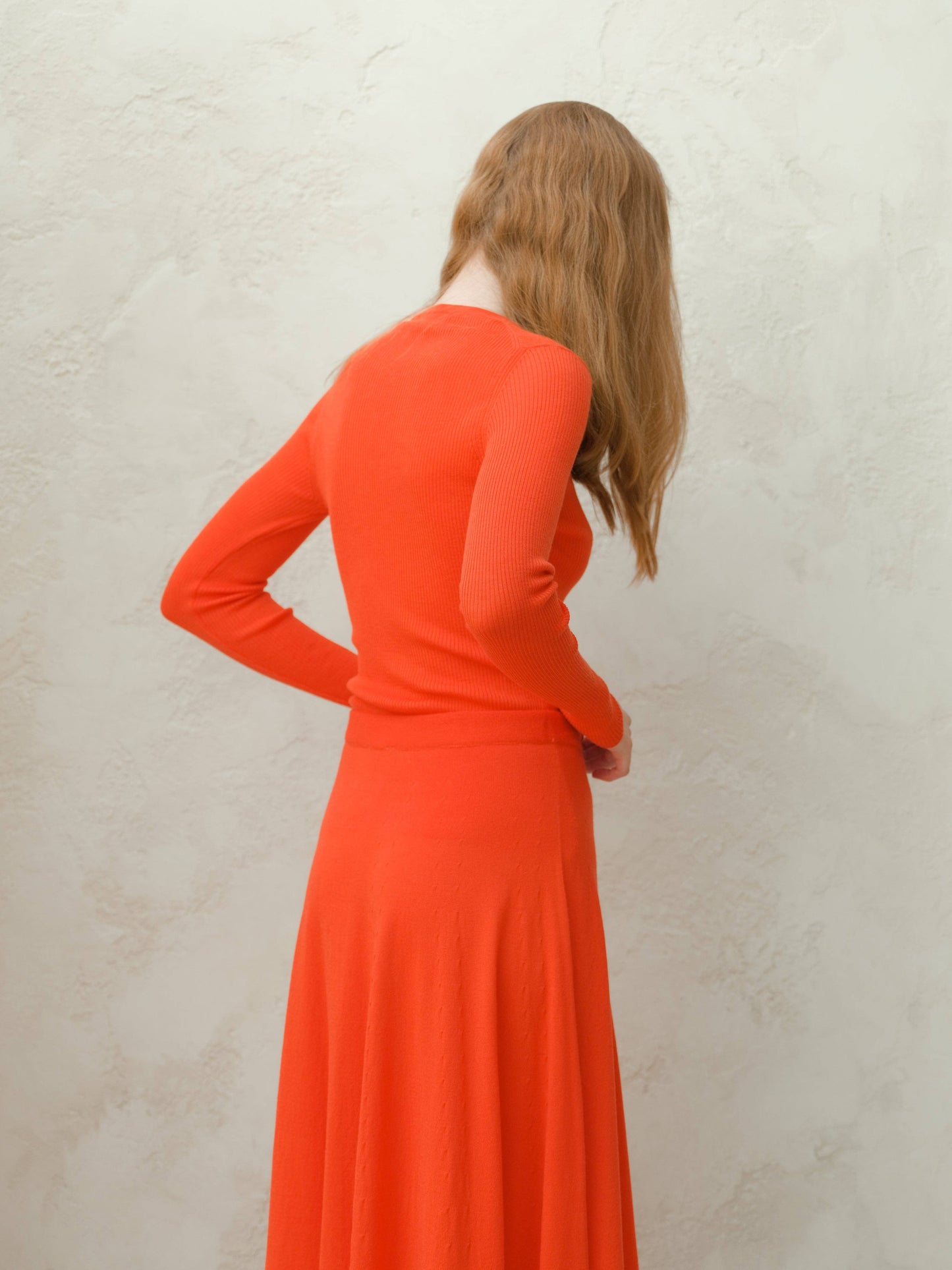 Maglione a costine in lana merino extra fine con bottoni
