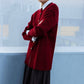 Cardigan lungo bordeaux con bottoni dorati