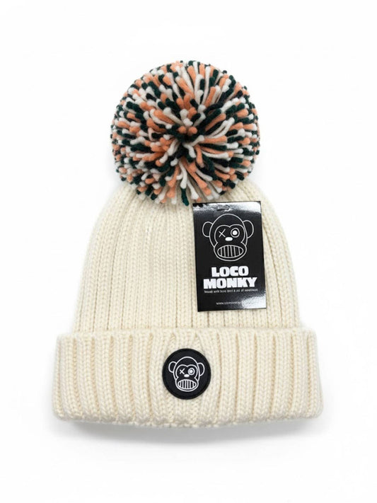 Berretto a costine con pompon e interno in eco-pelliccia