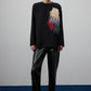 Tunica oversize nera con applicazione piumata multicolor