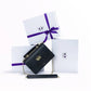 Mini borsa a tracolla in pelle liscia con pattina a W