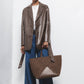 Cappotto in ecopelle con cintura