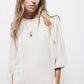 Blusa con pieghe e maniche a palloncino