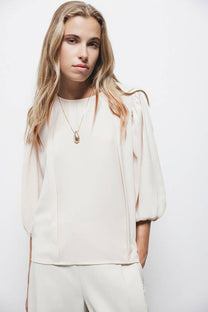 Blusa con pieghe e maniche a palloncino