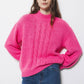 Maglione in maglia a trecce fucsia
