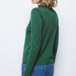 Maglione a maglia rasata con scollo a V e fiocco