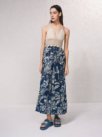 Abito lungo boho con top all’uncinetto e gonna floreale