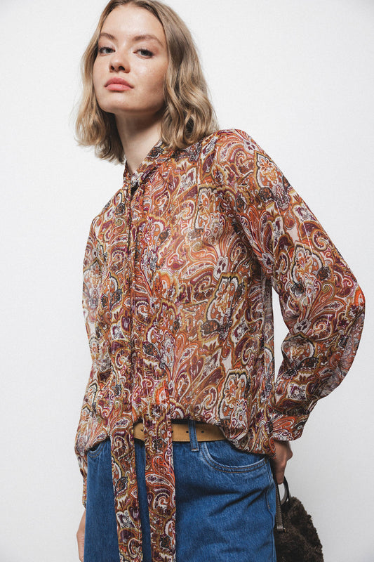 Blusa semitrasparente fantasia con fiocco al collo