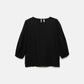 Blusa nera con pieghe e maniche a palloncino
