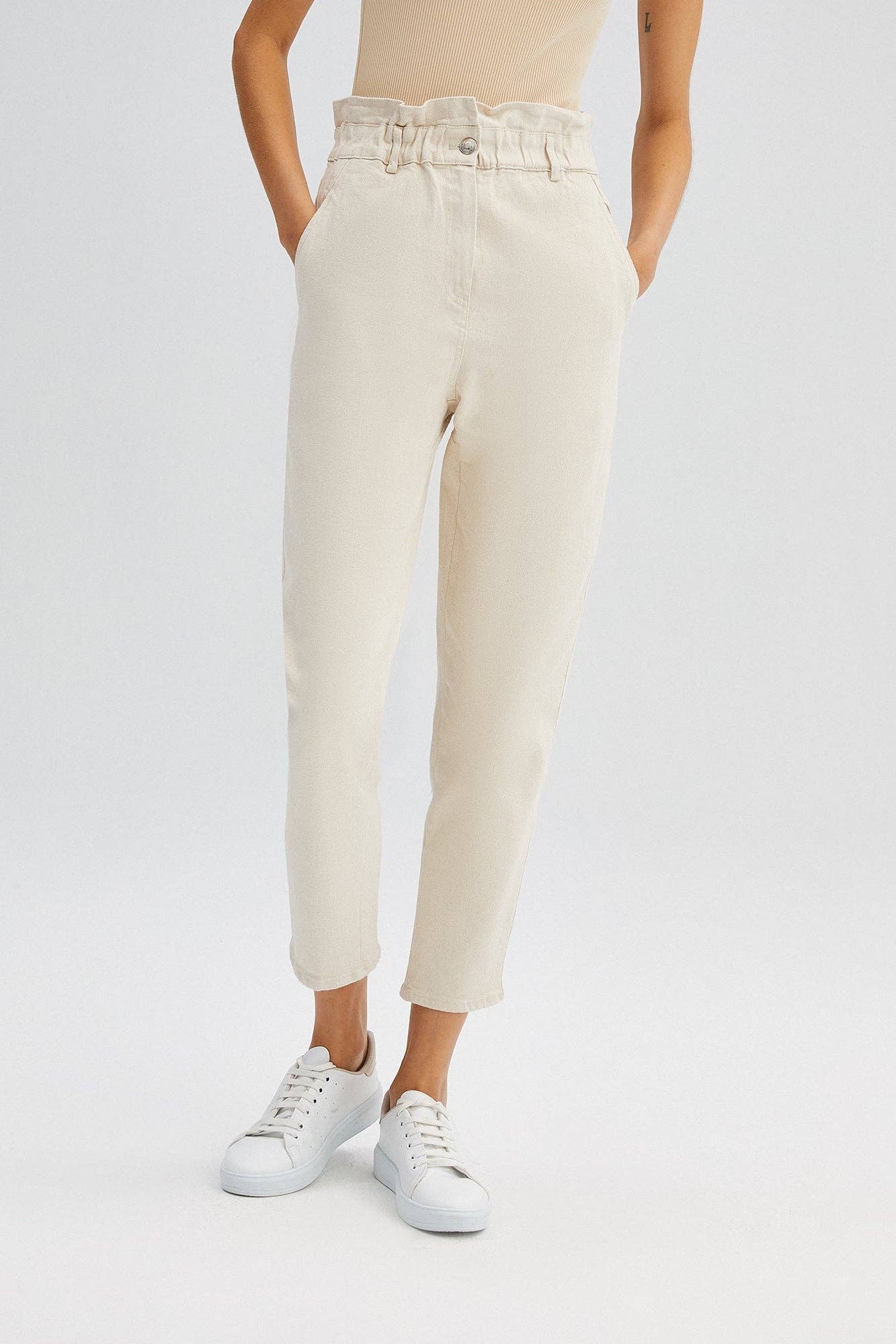 Pantaloni in denim carrot fit crema