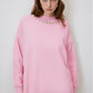 Maglione rosa con collo decorato in perle