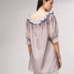Blusa lunga a pois con scollo a barca e volant