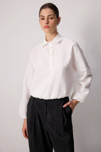 Blusa con bottoni sul davanti e orlo elasticizzato