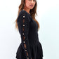 Maglia peplum con inserti in pizzo e bottoni