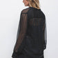 Blusa a pois semitrasparente con scollo a V