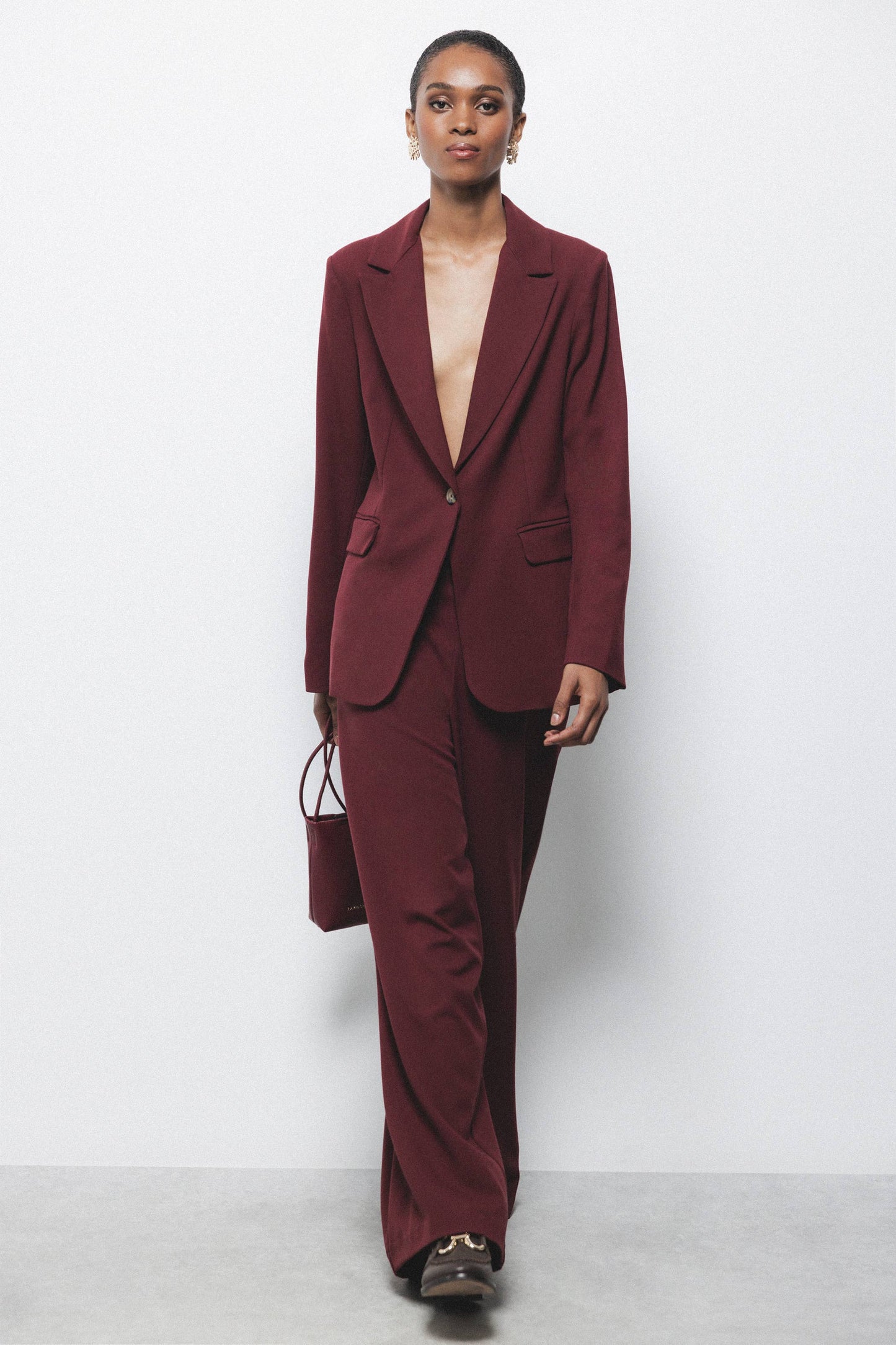 Pantaloni palazzo a gamba larga con zip laterale
