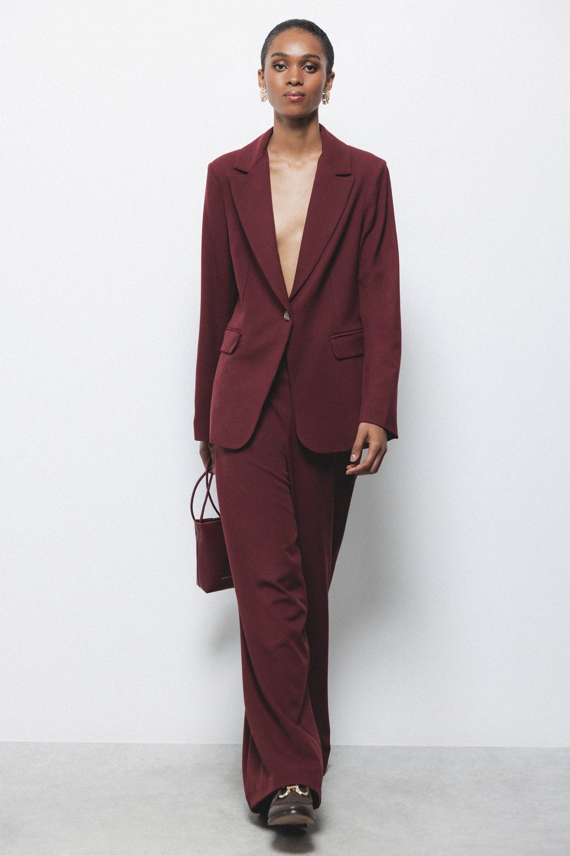Pantaloni palazzo a gamba larga con zip laterale