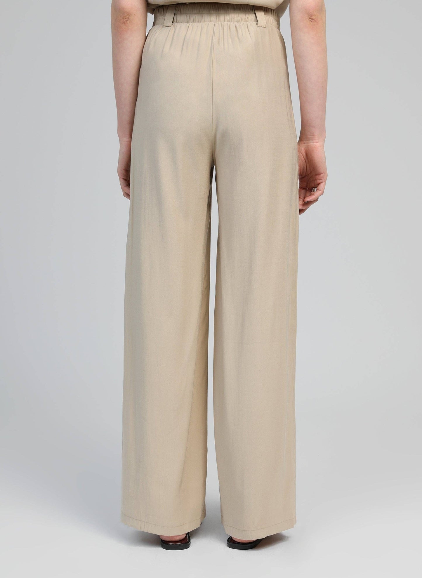 Pantaloni a zampa beige a vita alta