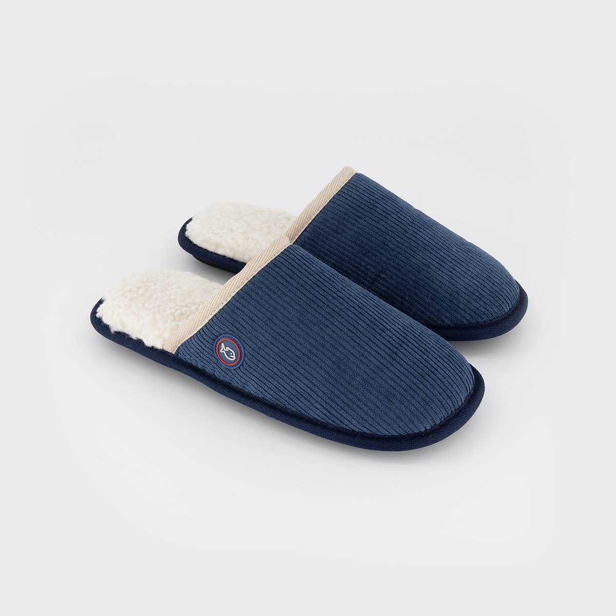 Pantofole in velluto a coste blu navy con interno in sherpa