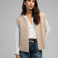 Cardigan smanicato in maglia beige
