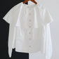 Blusa corta con balze e maniche a sbuffo in misto cotone