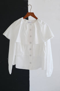 Blusa corta con balze e maniche a sbuffo in misto cotone