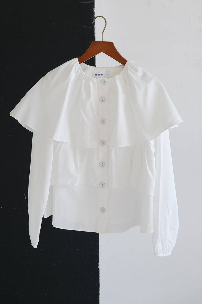 Blusa corta con balze e maniche a sbuffo in misto cotone