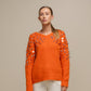 Maglione in maglia con paillettes sulle maniche