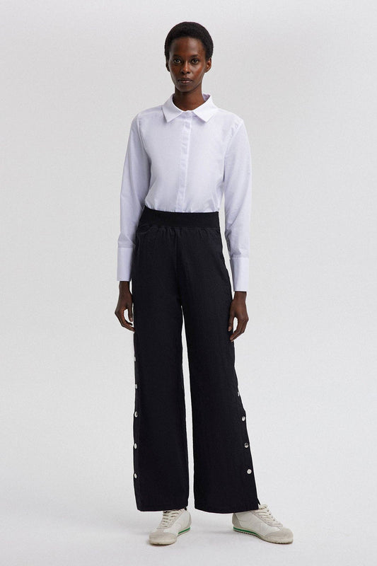 Pantaloni in cotone con vita elastica e bottoni a pressione laterali