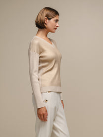 Maglione donna laminato a costine con scollo a V
