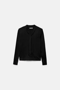 Maglione in maglia rasata con scollo a V e fiocco