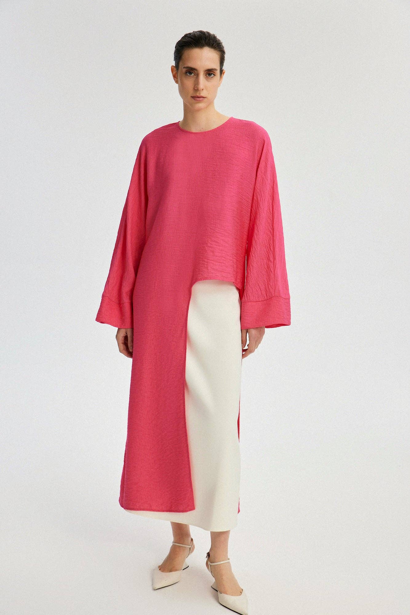 Tunica lunga con spacco frontale fucsia