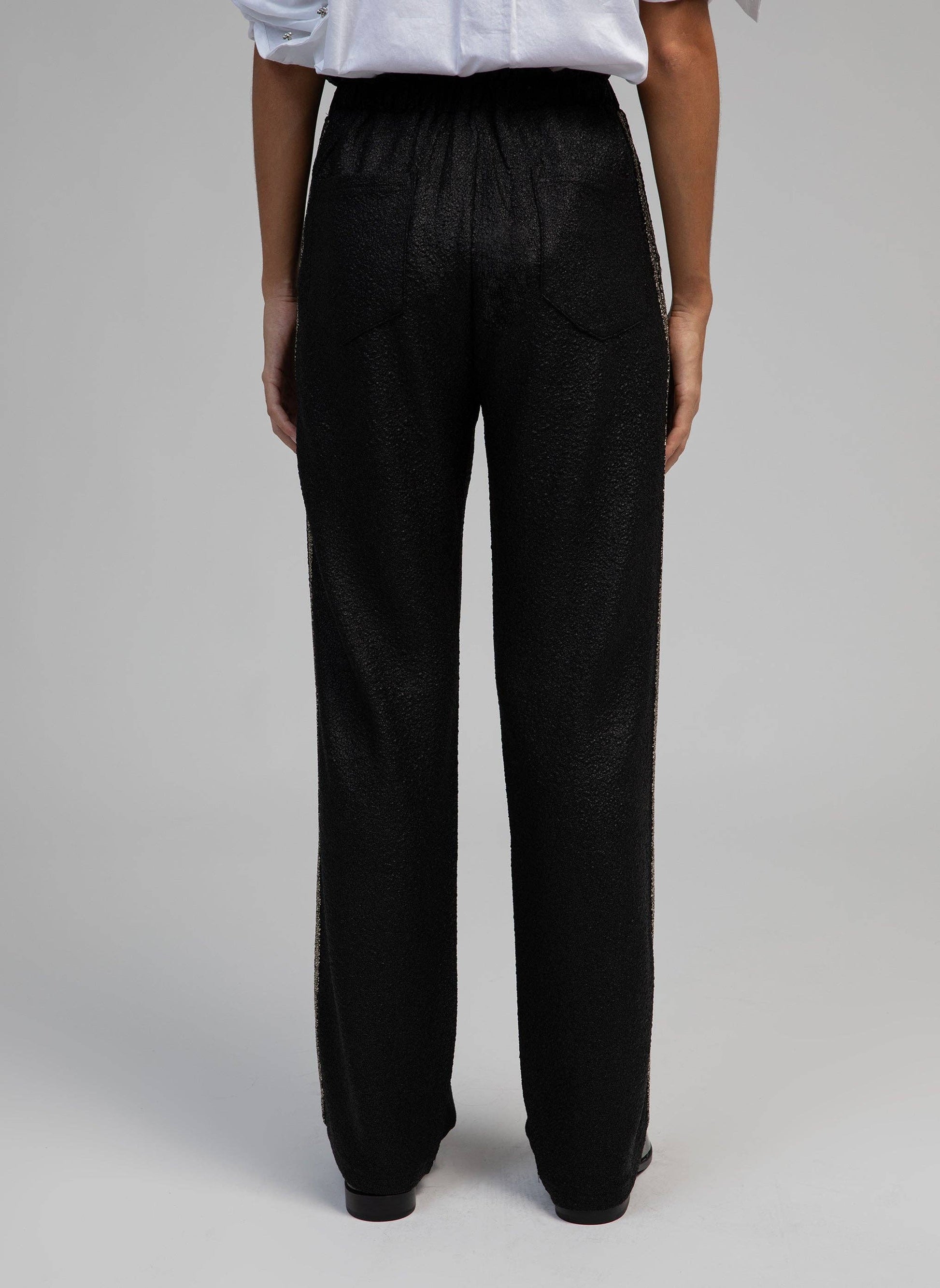 Pantaloni Pierroly effetto pelle neri con bande argento
