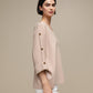 Maglione oversize con scollo a V e bottoni gioiello