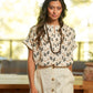 Blusa con stampa geometrica