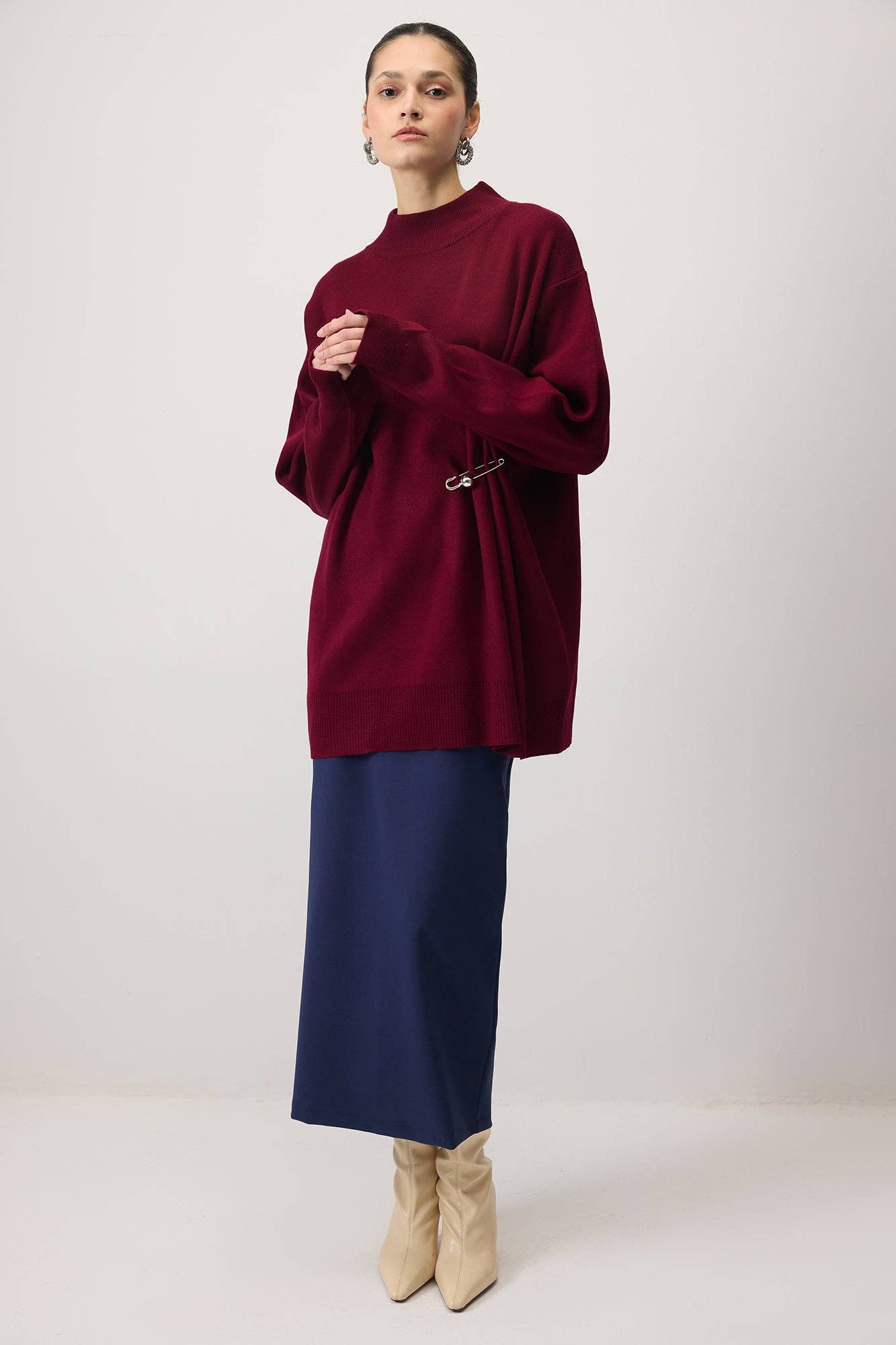 Tunica in maglia oversize con accessorio metallico