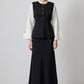 Gilet aderente con bottoni dorati