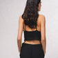 Top cropped all’uncinetto a triangolo