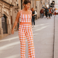 Pantaloni in maglia a fantasia arancio e bianco