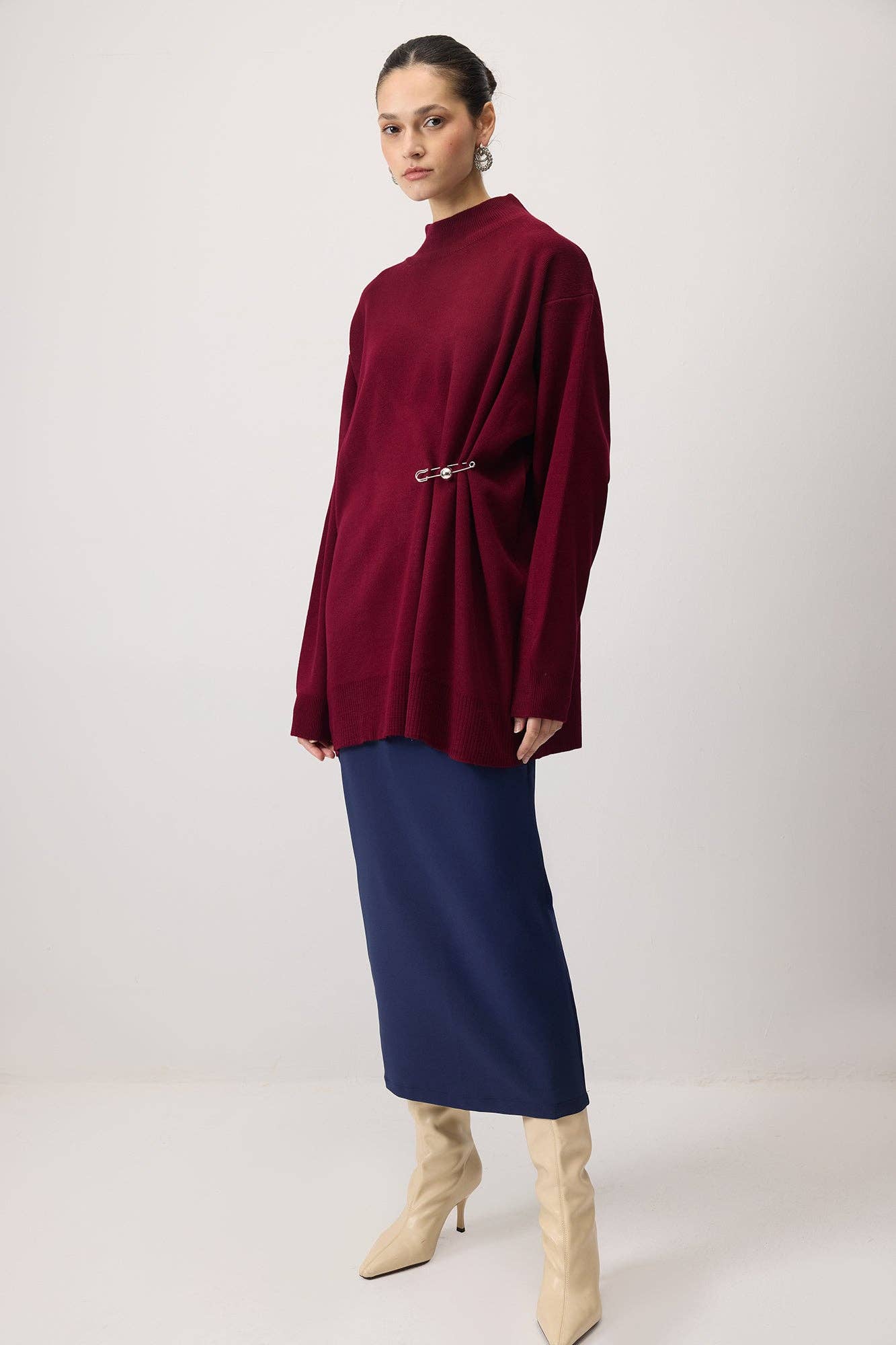 Tunica in maglia oversize con accessorio metallico